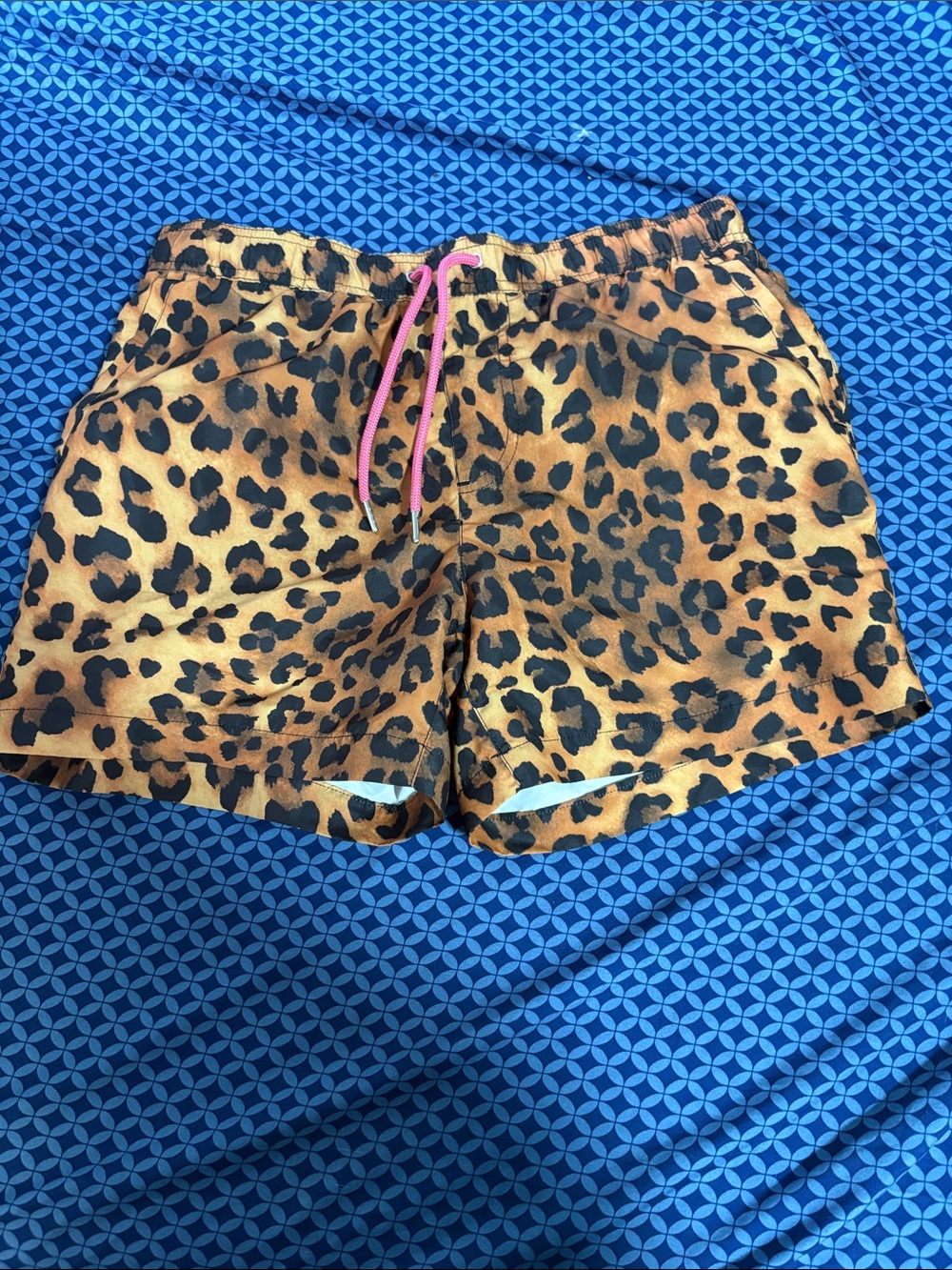 Stylish cheetah print beach shorts perfect for summer wear great condition